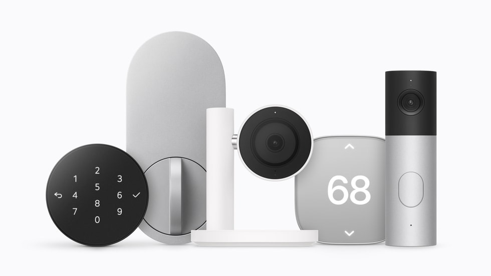 The Apple Home Collection lined up on a white background: a video doorbell, a floodlight camera, outdoor and indoor cameras, a smart deadbolt lock, two thermostats and two small sensors.