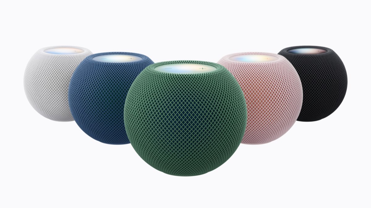 Five HomePod mini 2 speakers in a row, in white, blue, green, pink and midnight.